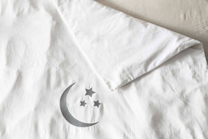 Moon and stars embroidered cot duvet cover in organic sateen cotton